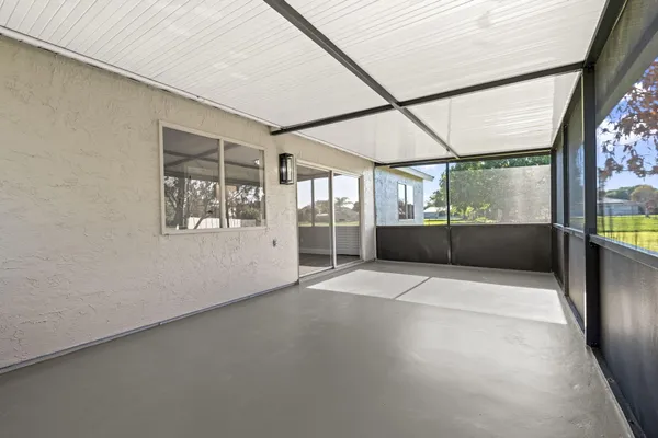 a view of an empty room with a fireplace