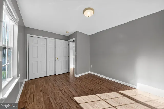a bathroom with a sink a toilet and shower curtain