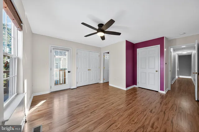 a view of balcony with wooden floor and fence