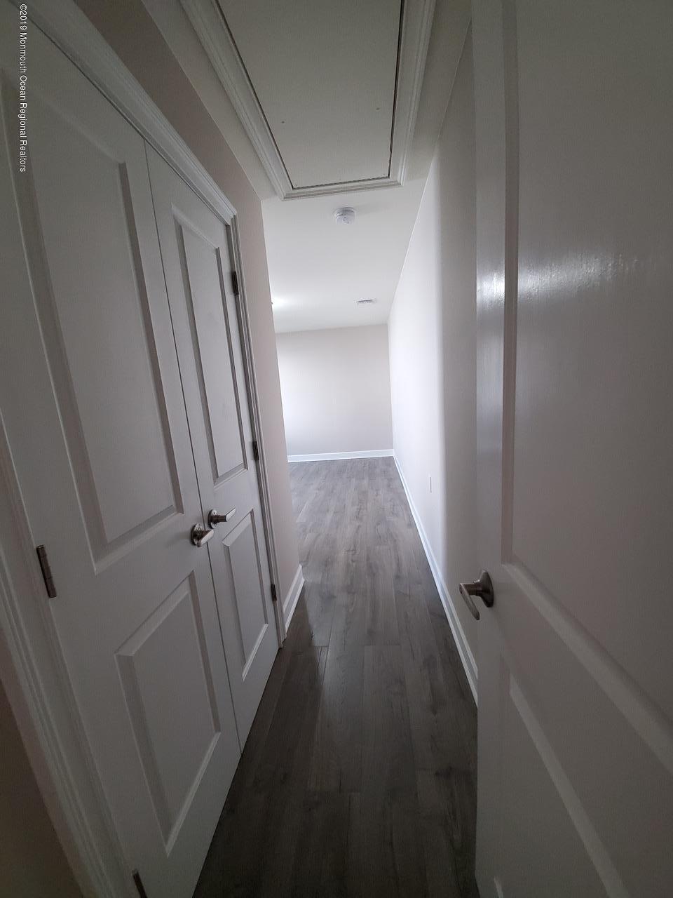 7 Patmore Road Brick, NJ 08724 - Photo 4 of 10 a view of a hallway with wooden floor