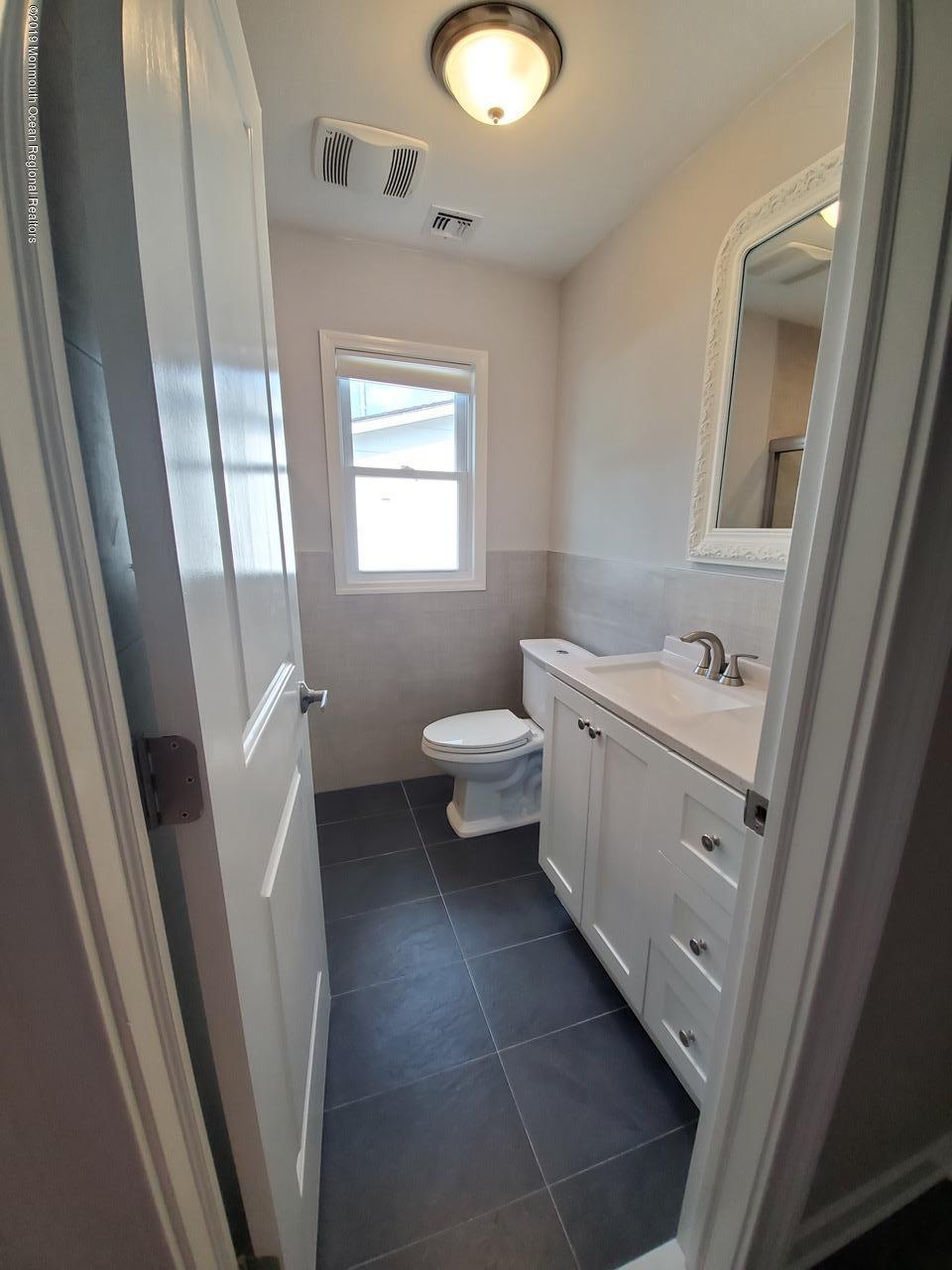7 Patmore Road Brick, NJ 08724 - Photo 6 of 10 a bathroom with a sink a toilet and a mirror
