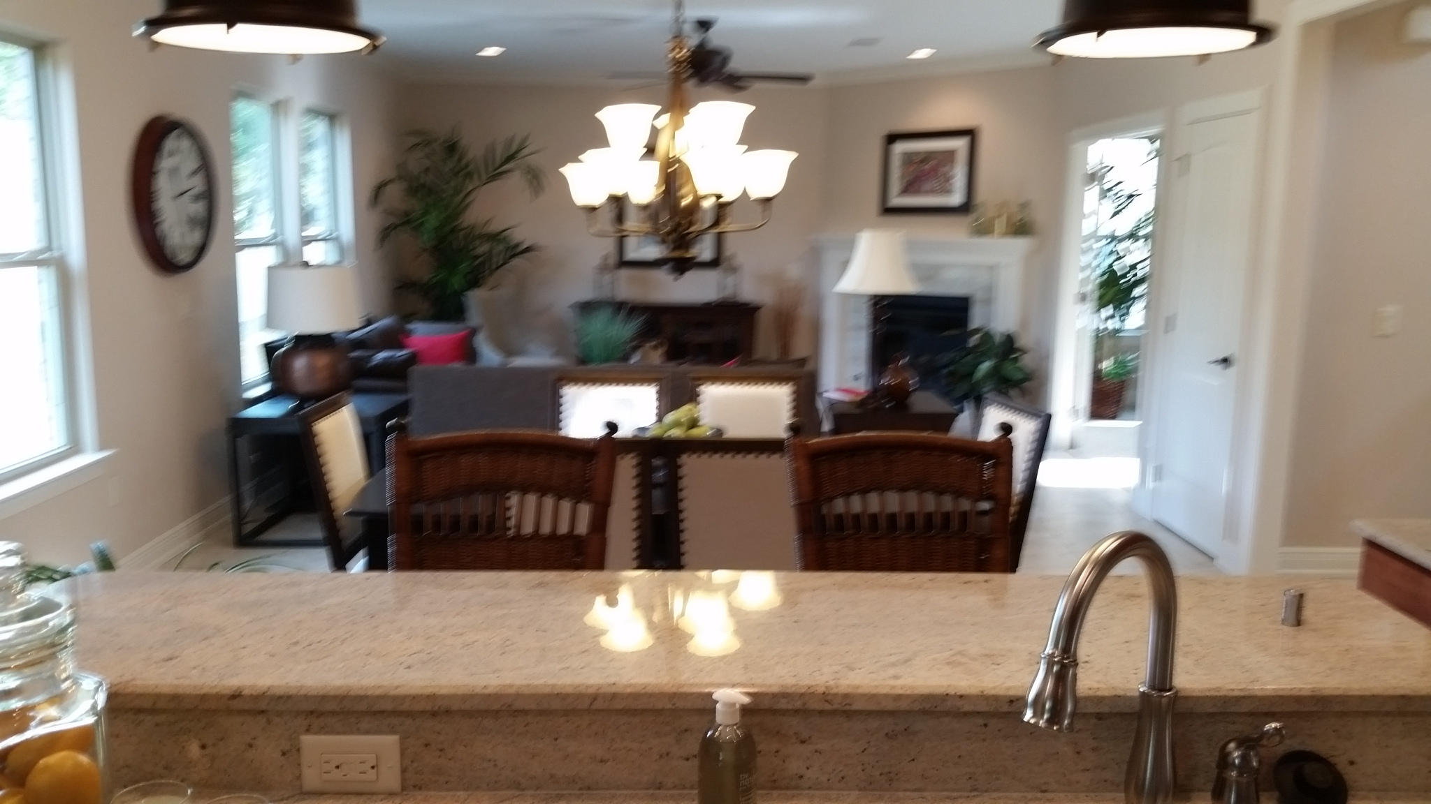 205 Rigdon Court Northwest Fort Walton Beach, FL 32548 - Photo 13 of 48 a living room with furniture a fireplace and a chandelier