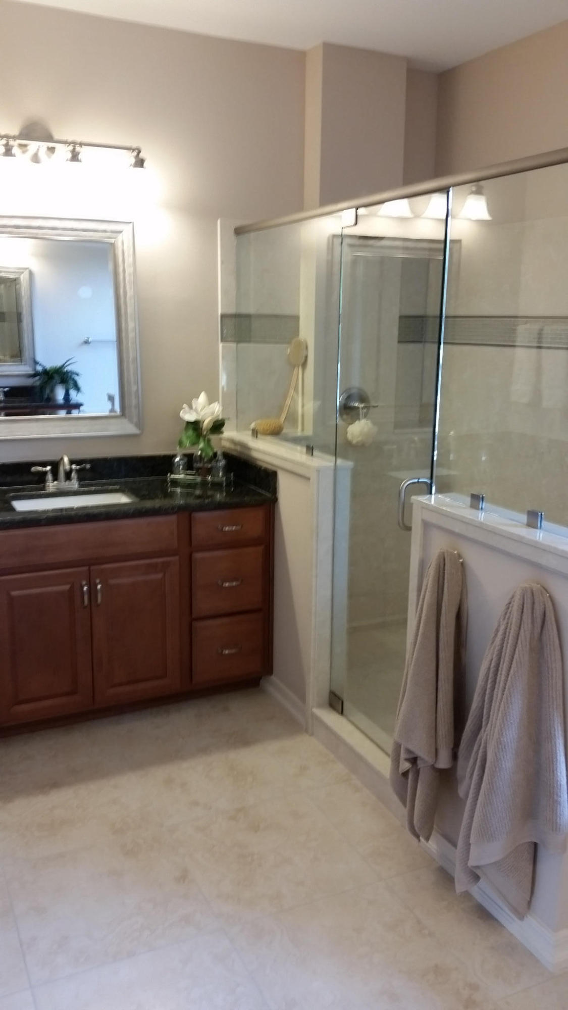 205 Rigdon Court Northwest Fort Walton Beach, FL 32548 - Photo 28 of 48 a bathroom with a granite countertop sink a vanity and a mirror