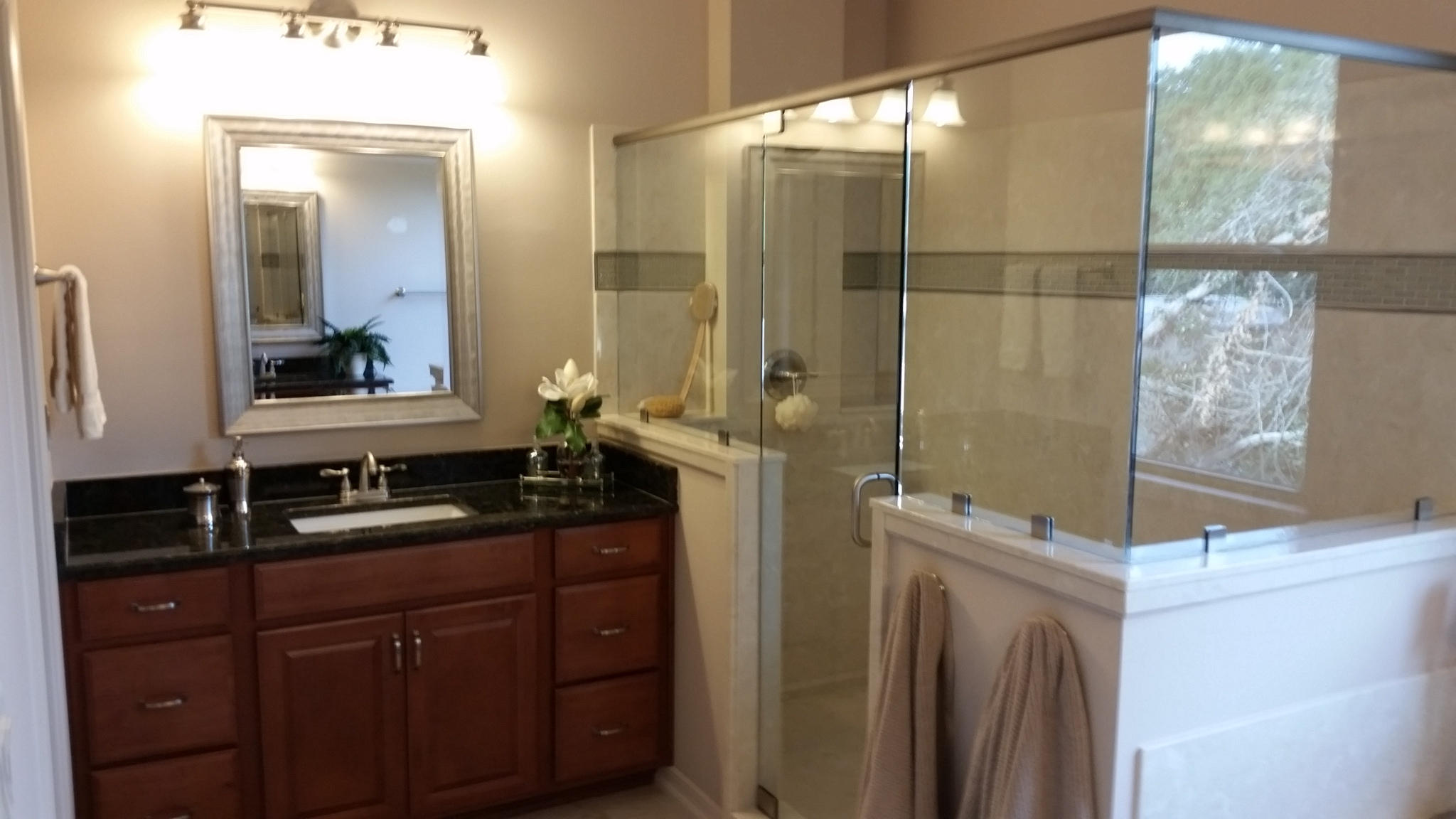 205 Rigdon Court Northwest Fort Walton Beach, FL 32548 - Photo 29 of 48 a bathroom with a granite countertop sink a mirror and shower