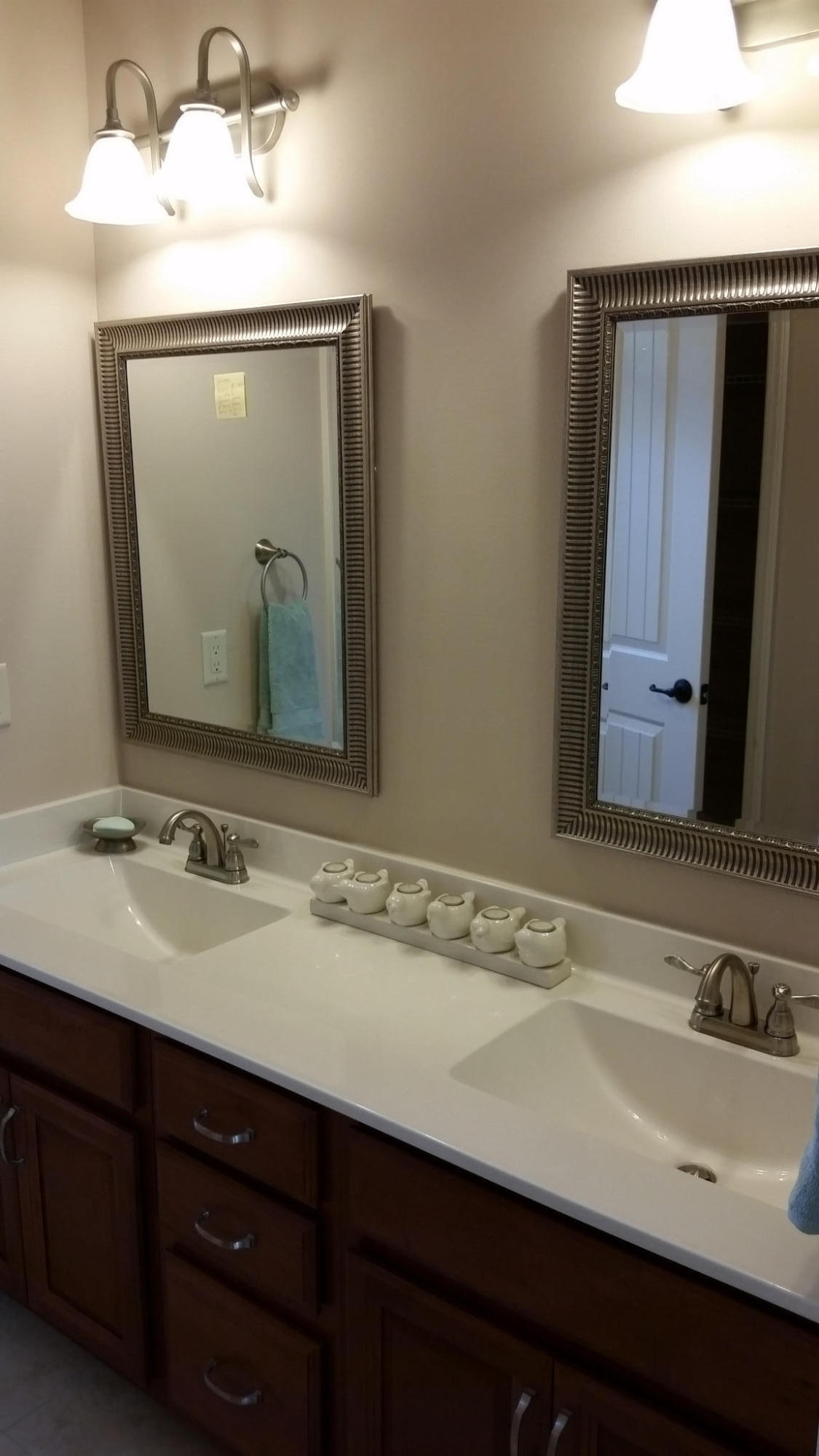 205 Rigdon Court Northwest Fort Walton Beach, FL 32548 - Photo 37 of 48 a bathroom with a sink vanity and a mirror