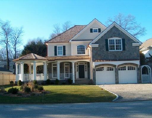 24 Center Road Greenwich, CT 06870 - Photo 1 of 1 a front view of a house with a yard
