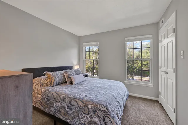 a bathroom with a toilet sink and vanity