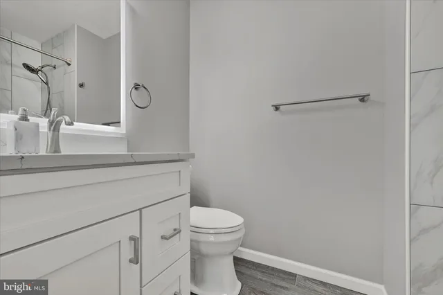 a view of a dining room with furniture and a potted plant