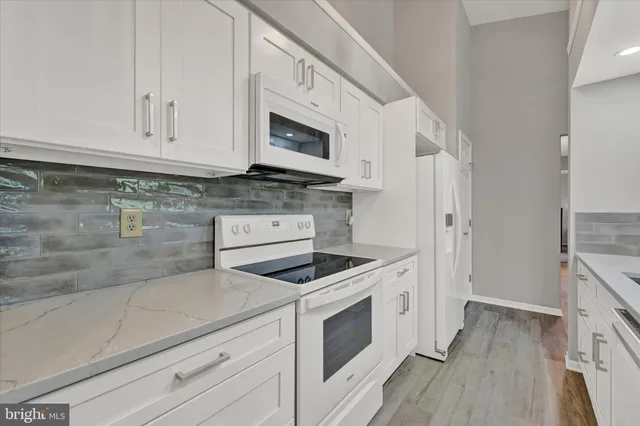 a kitchen with cabinets and sink