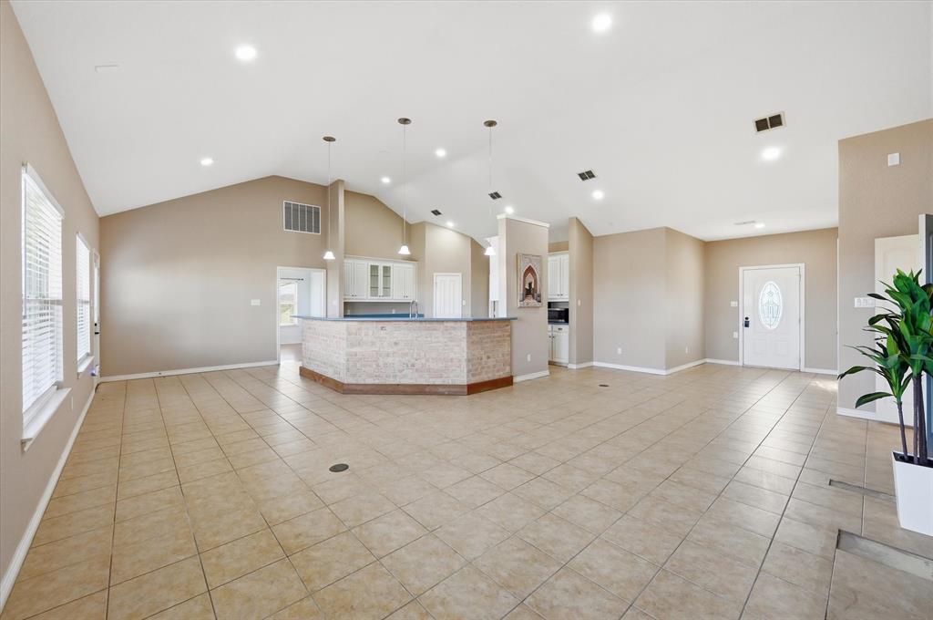 1616 Nash-Howard Road Waxahachie, TX 75165 - Photo 17 of 36 a view of a kitchen with a sink and a refrigerator in it