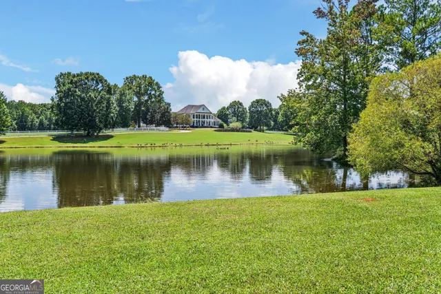 a kitchen with a sink appliances and cabinets