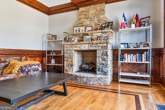 a dining room with furniture and wooden floor