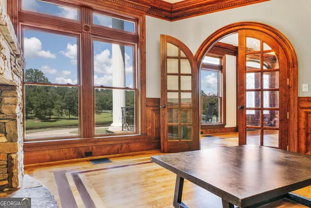 a living room with furniture and stairs