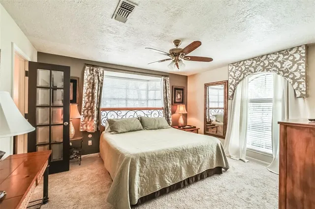 a bathroom with a toilet and shower