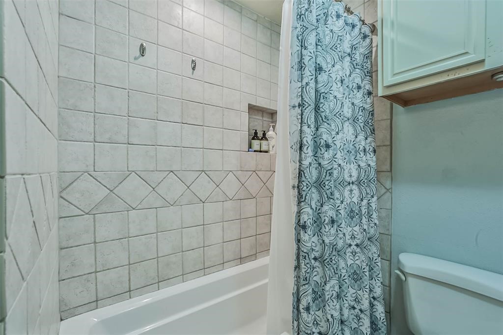 6911 Sprigg Street Fulshear, TX 77441 - Photo 28 of 48 a bathroom with a toilet and shower