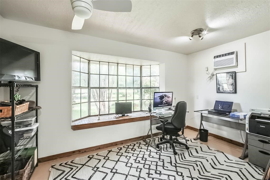 6911 Sprigg Street Fulshear, TX 77441 - Photo 36 of 48 a living room with furniture and a flat screen tv