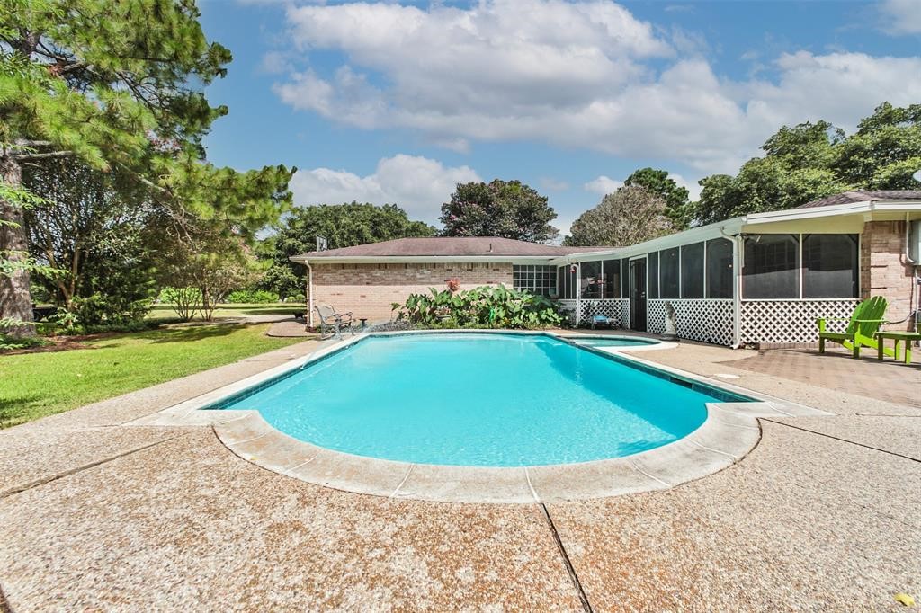 6911 Sprigg Street Fulshear, TX 77441 - Photo 40 of 48 a view of outdoor space yard swimming pool and patio