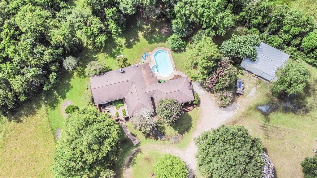 6911 Sprigg Street Fulshear, TX 77441 - Photo 47 of 48 an aerial view of a house with swimming pool and garden