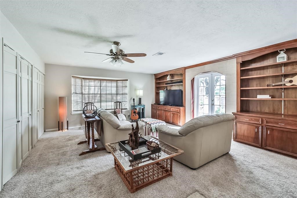 6911 Sprigg Street Fulshear, TX 77441 - Photo 8 of 48 a living room with furniture a desk and a rug
