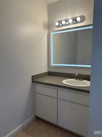 a bathroom with a sink and mirror
