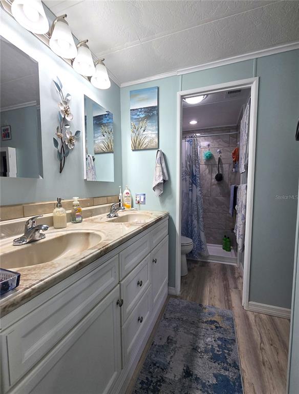 5619 Bayshore Road, Unit 435 Palmetto, FL 34221 - Photo 30 of 56 a spacious bathroom with double vanity and a mirror