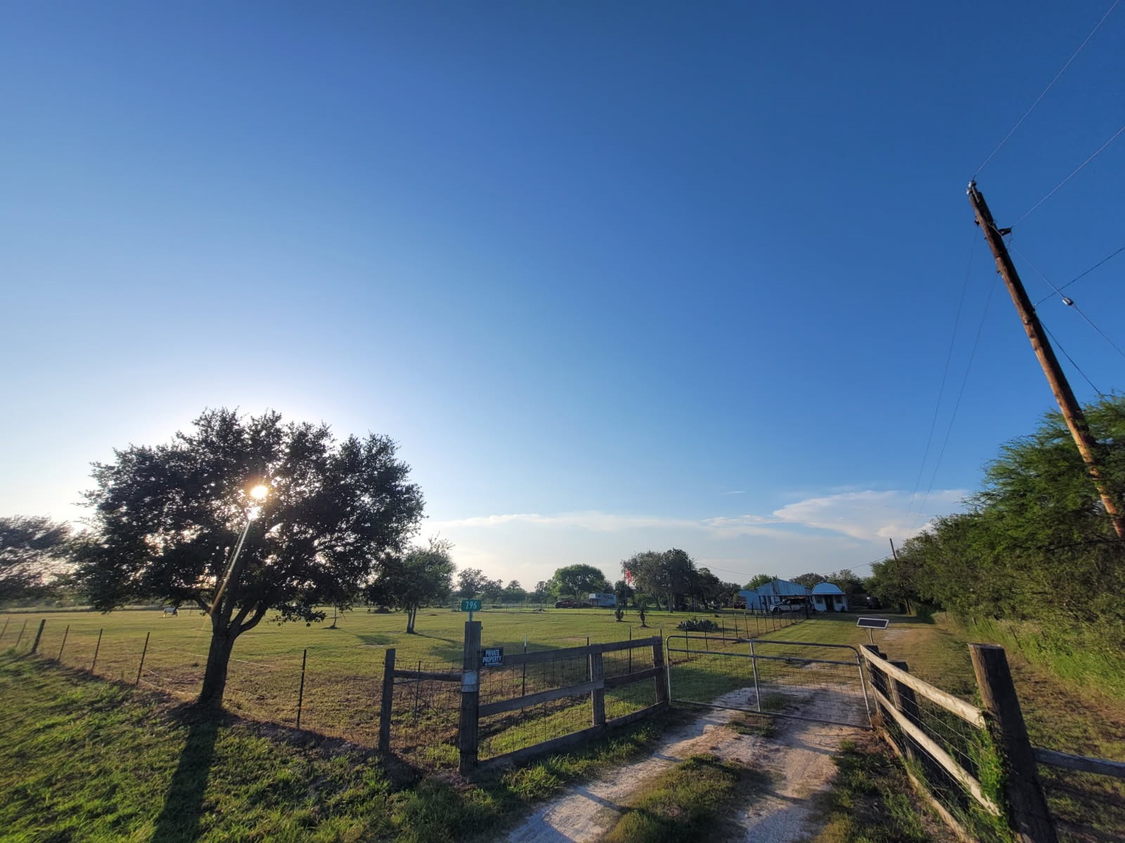 796 Shelly Road Goliad, TX 77963 - Photo 3 of 37 Expansive rural property with a charming home, surrounded by lush greenery and open fields, perfect for serene country living.
