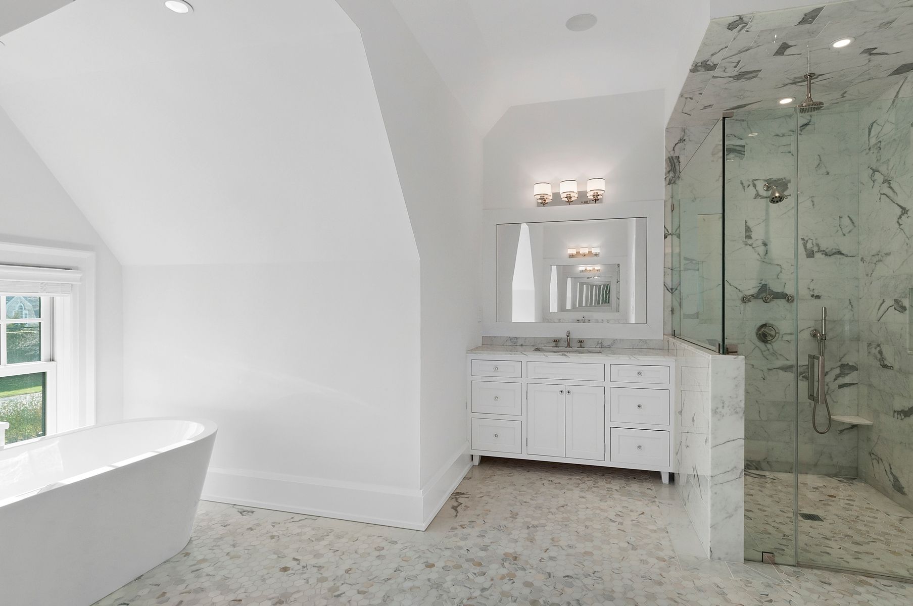 107 Wickapogue Road Southampton, NY 11968 - Photo 9 of 18 a bathroom with a granite countertop sink a mirror and a bathtub