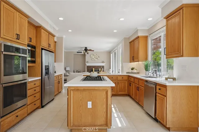 a kitchen with a sink stove and refrigerator