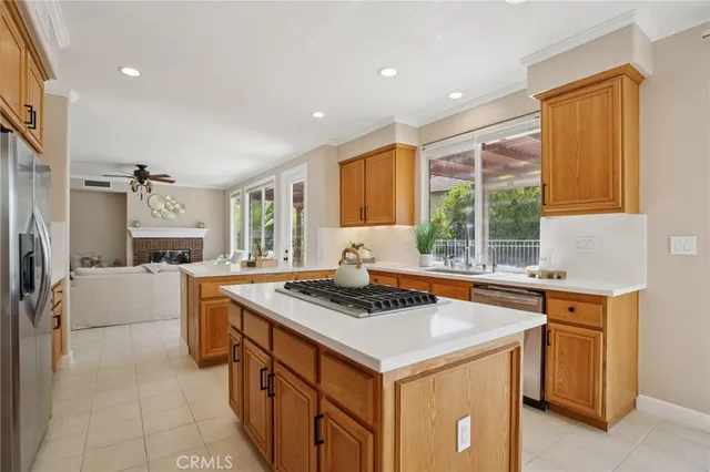 a view of walk in closet with hardwood