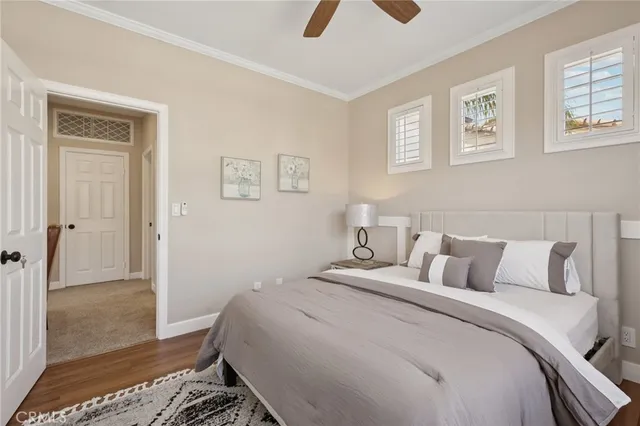 a bedroom with a bed and a chair