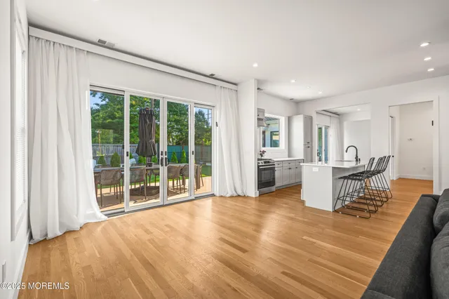 a kitchen with a sink stainless steel appliances and cabinets
