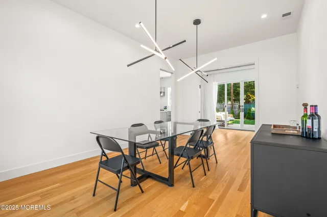 a bedroom with a bed and a mirror