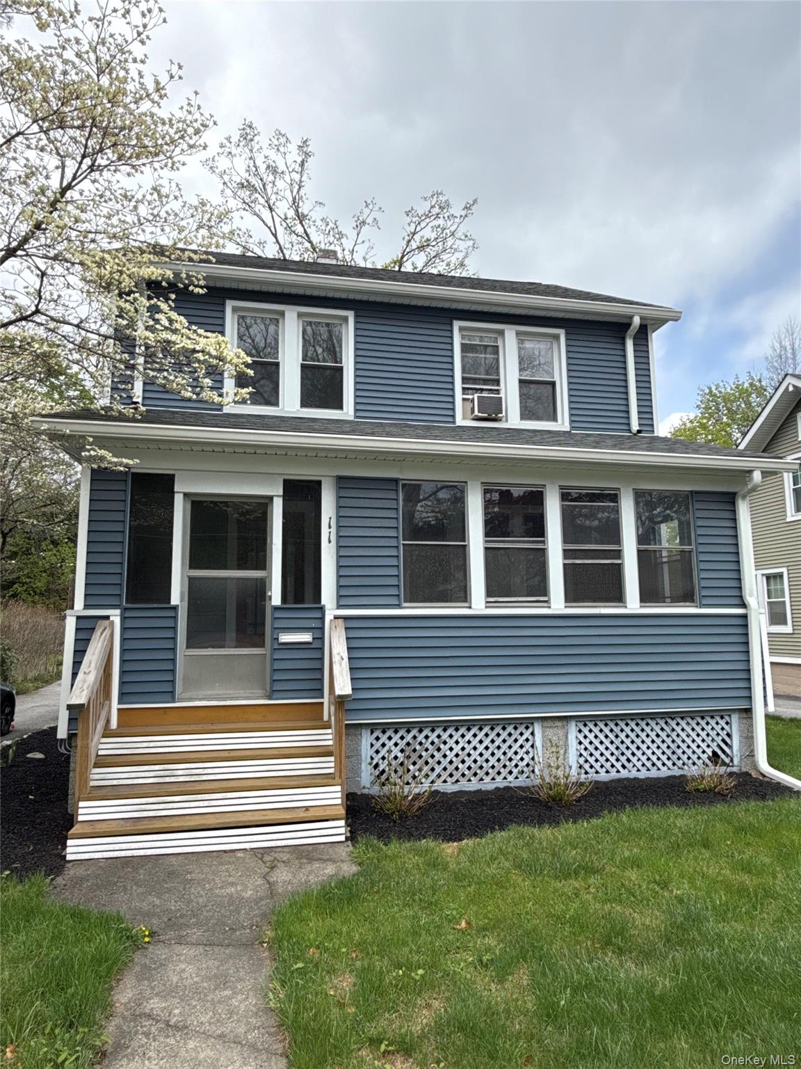 110 Innis Avenue Poughkeepsie, NY 12601 - Photo 1 of 22 a front view of a house with a garden