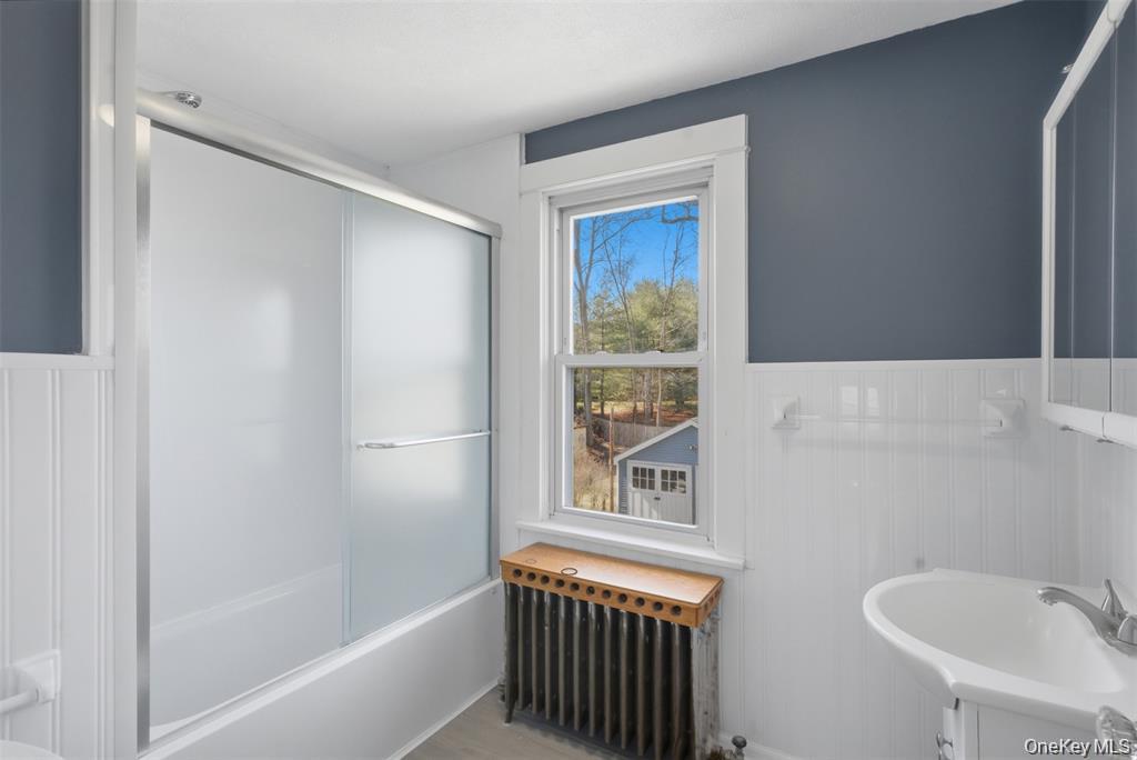 110 Innis Avenue Poughkeepsie, NY 12601 - Photo 16 of 22 a bathroom with a bathtub and a sink