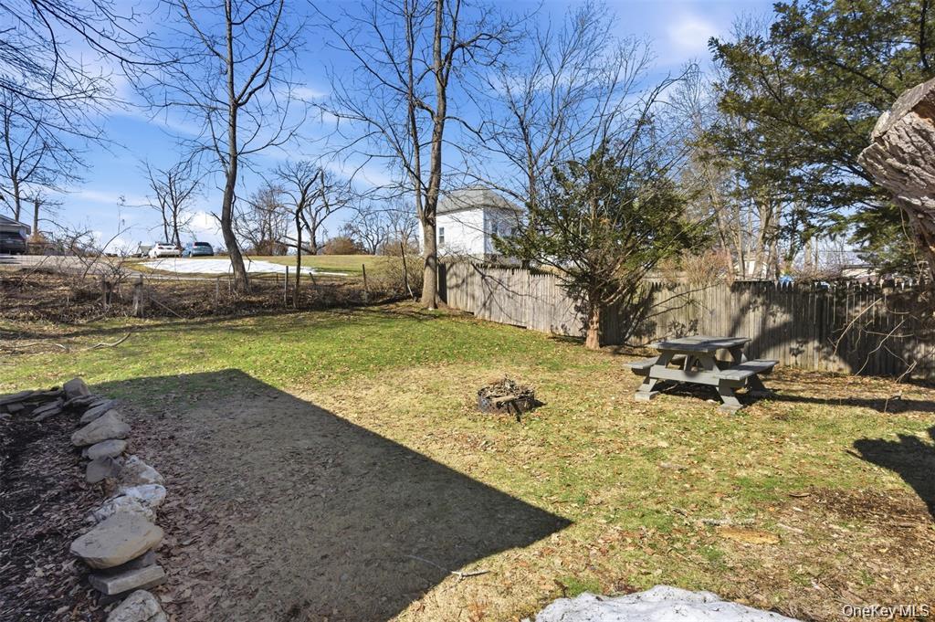 110 Innis Avenue Poughkeepsie, NY 12601 - Photo 20 of 22 a view of a backyard with large trees