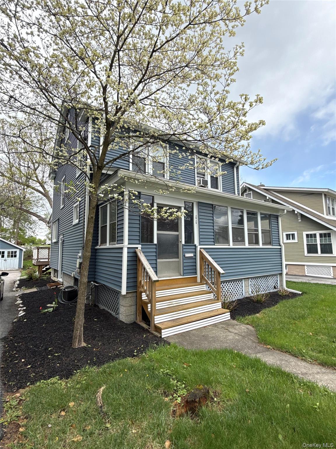 110 Innis Avenue Poughkeepsie, NY 12601 - Photo 2 of 22 a front view of a house with a yard