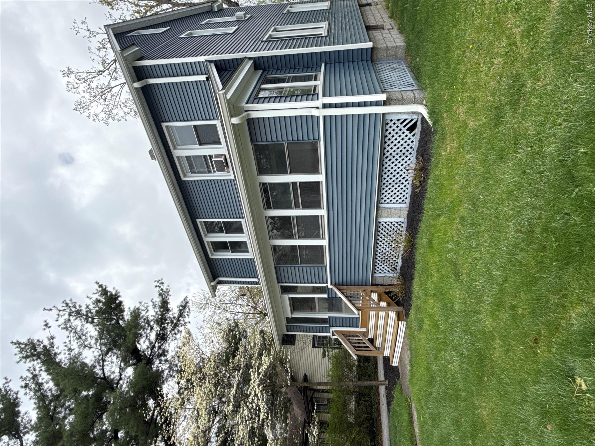 110 Innis Avenue Poughkeepsie, NY 12601 - Photo 3 of 22 a front view of a house with a garden