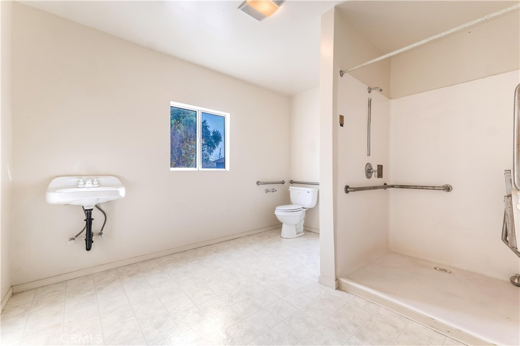 7508 Etiwanda Avenue Reseda, CA 91335 - Photo 21 of 32 a bathroom with a shower toilet and a sink