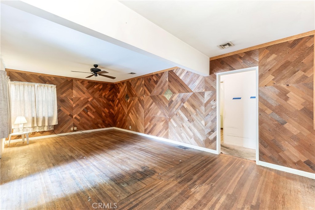 7508 Etiwanda Avenue Reseda, CA 91335 - Photo 6 of 32 a view of empty room with wooden floor and fan