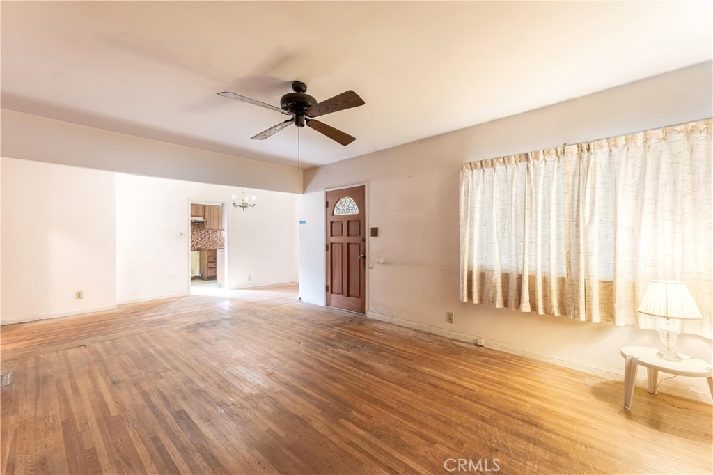 7508 Etiwanda Avenue Reseda, CA 91335 - Photo 8 of 32 a view of empty room with wooden floor and fan