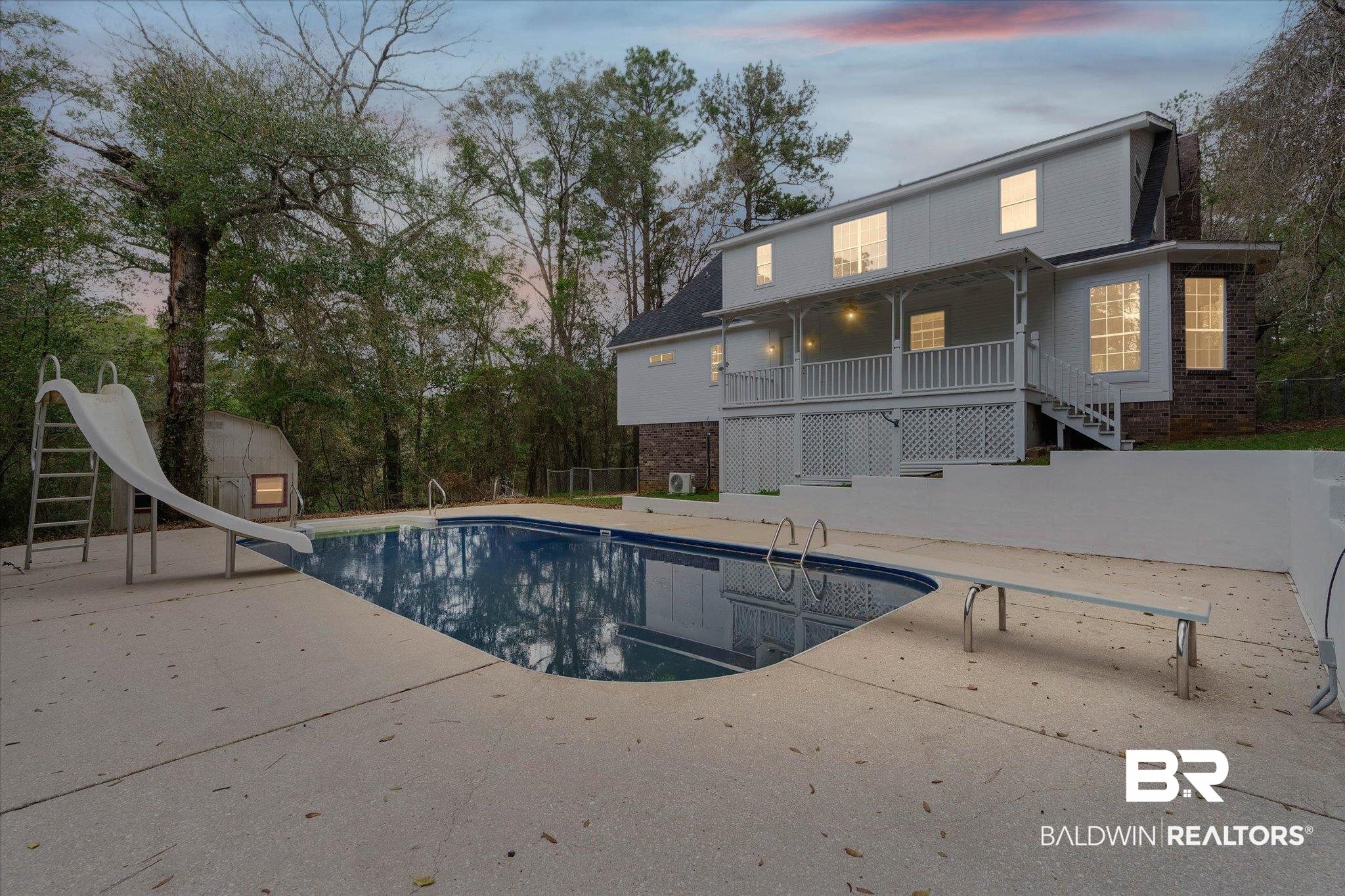 106 Melanie Loop Daphne, AL 36526 - Photo 3 of 45 Outdoor pool featuring a water slide, a patio, a diving board, an outbuilding, and view of scattered trees