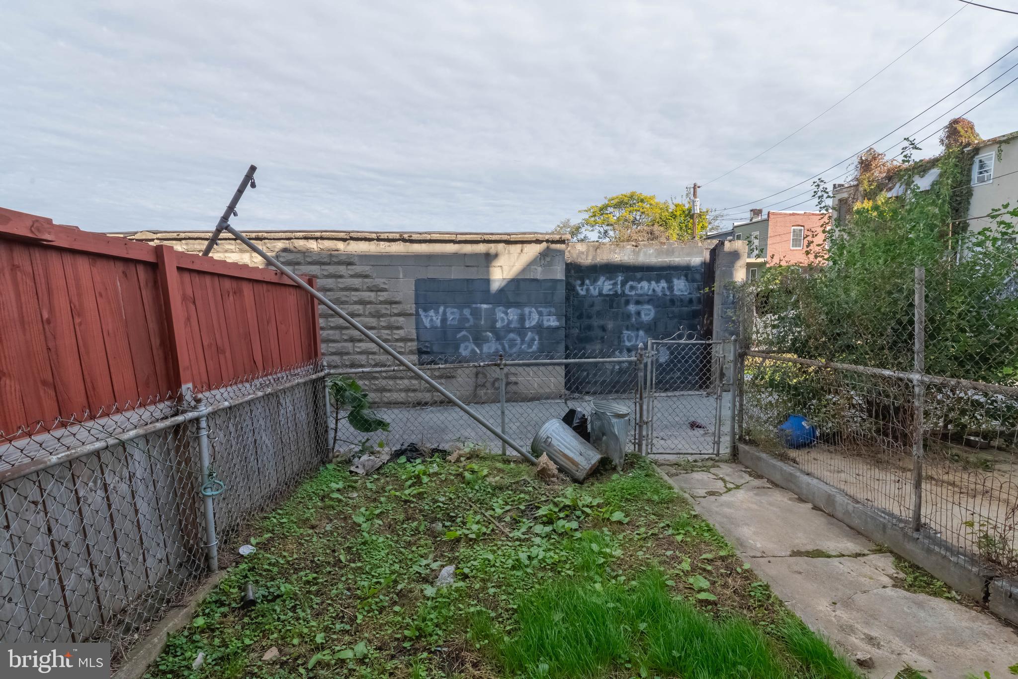 2216 West Fayette Street Baltimore, MD 21223 - Photo 32 of 36 a view of a garden with wooden fence