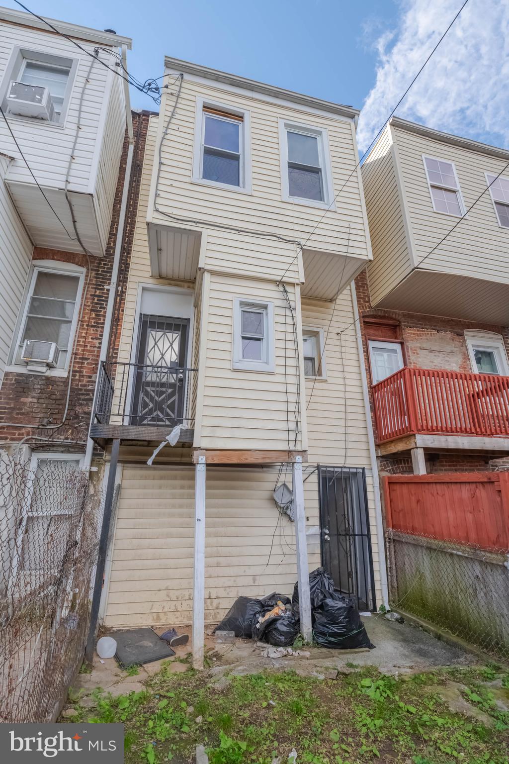2216 West Fayette Street Baltimore, MD 21223 - Photo 33 of 36 a front view of a house with a yard