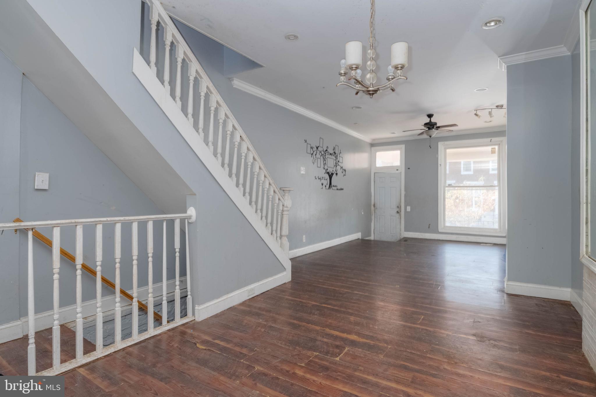 2216 West Fayette Street Baltimore, MD 21223 - Photo 8 of 36 a view of a hallway with wooden floor and staircase