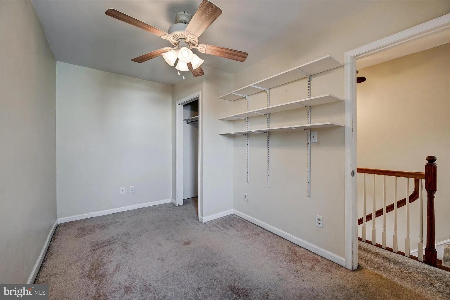 3188 Mercer Street Philadelphia, PA 19134 - Photo 11 of 14 Cozy room with ceiling fan and shelves.