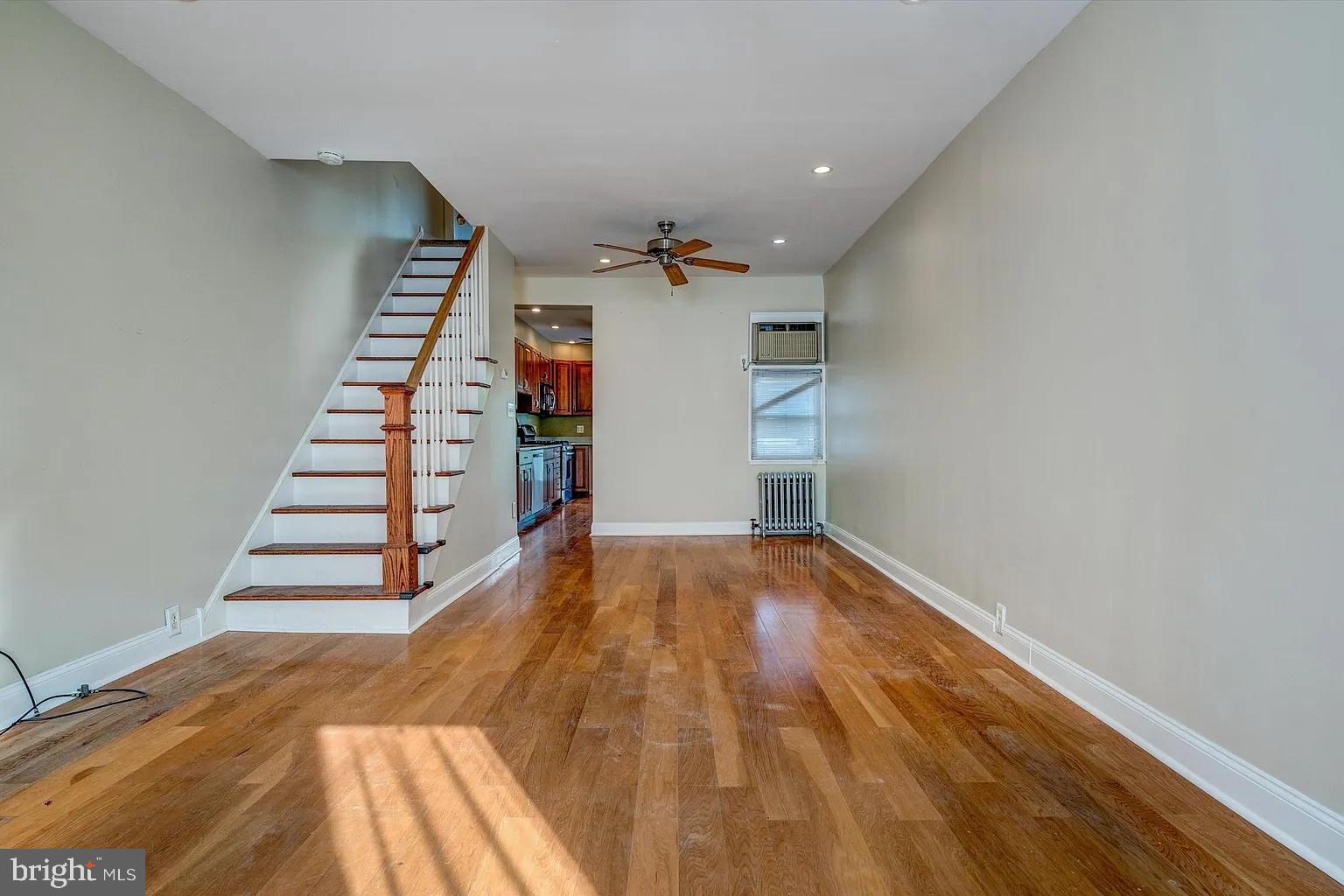 3188 Mercer Street Philadelphia, PA 19134 - Photo 2 of 14 Spacious living area with warm wood floors.