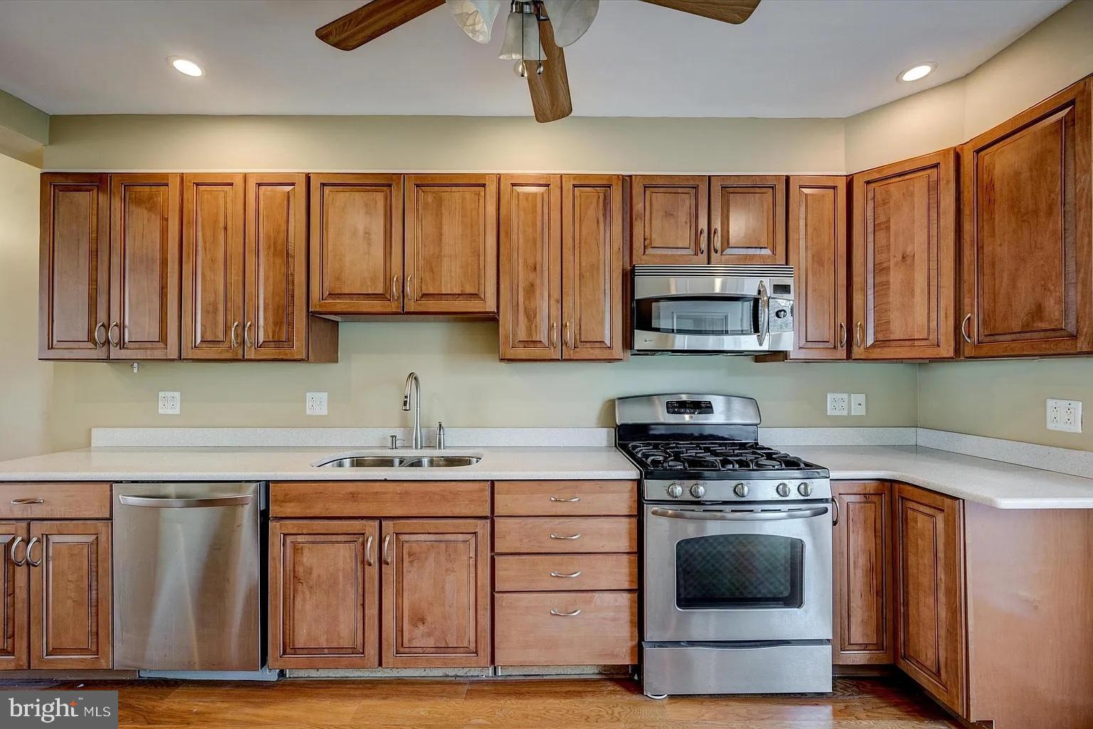 3188 Mercer Street Philadelphia, PA 19134 - Photo 4 of 14 Modern kitchen with warm wood cabinetry.