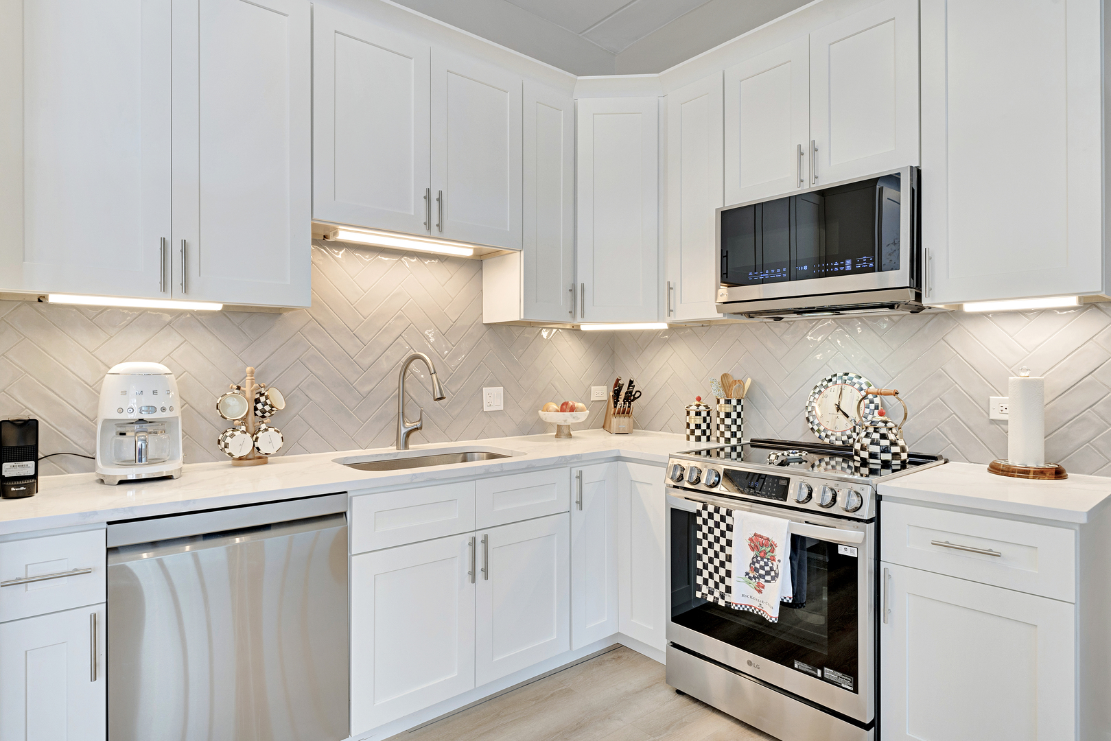 650 West Wayman Street, Unit 508 Chicago, IL 60661 - Photo 3 of 23 a kitchen with stainless steel appliances granite countertop a sink a stove a microwave and cabinets