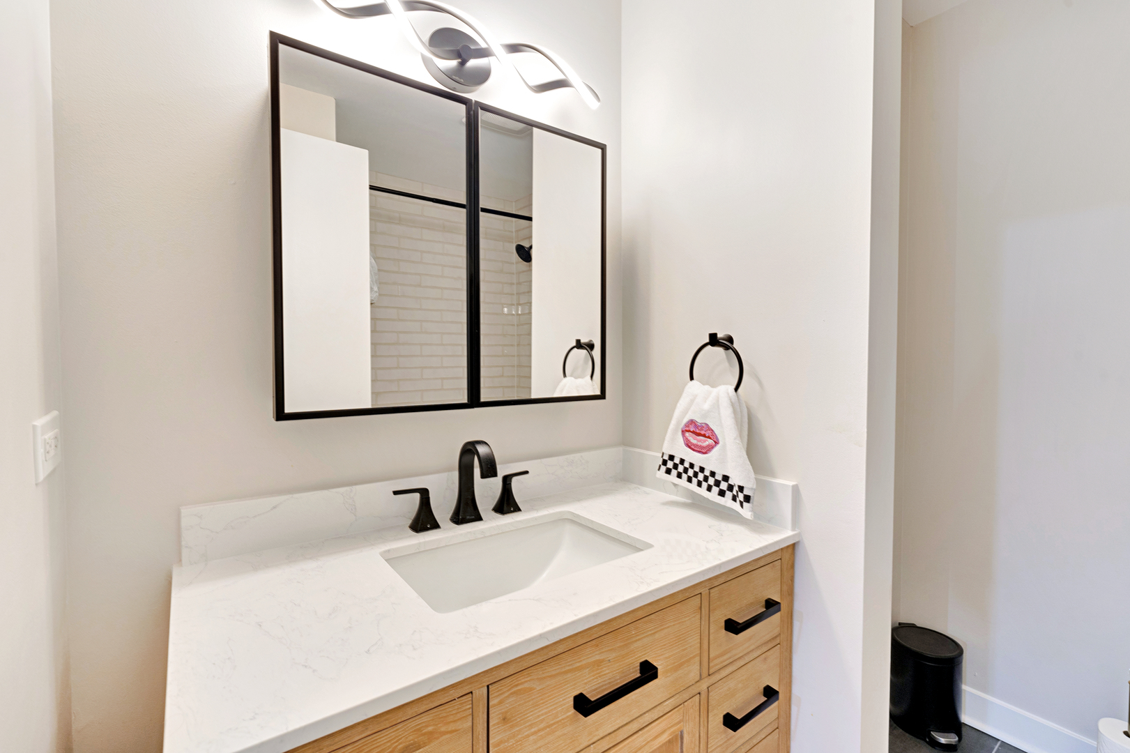 650 West Wayman Street, Unit 508 Chicago, IL 60661 - Photo 9 of 23 a bathroom with a sink and a mirror