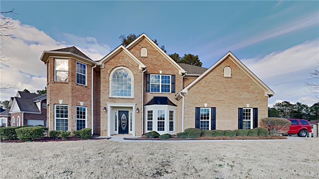 3483 Eagle Rise Lithonia, GA 30038 - Photo 1 of 1 a front view of a house with a yard